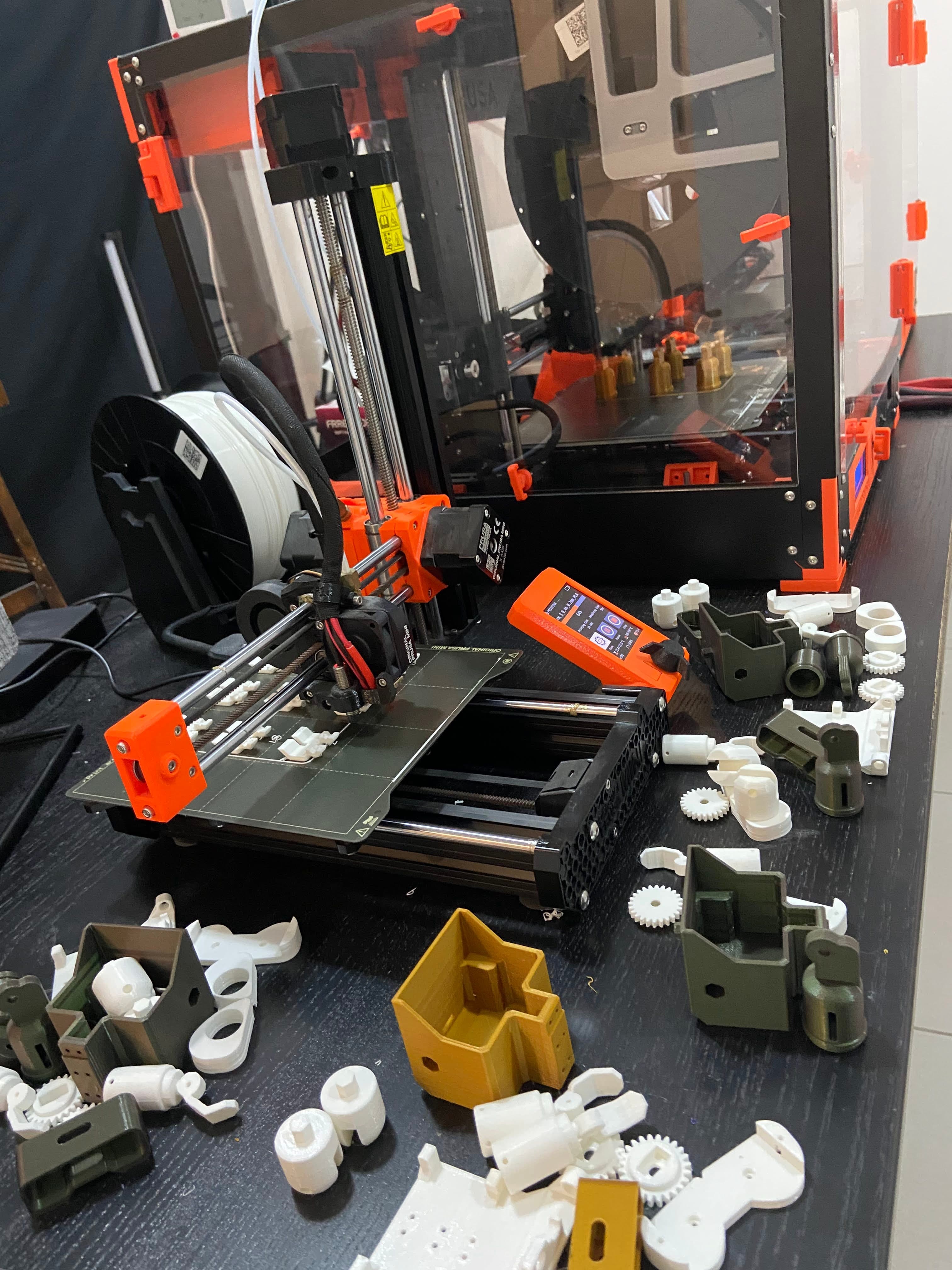 3D printed robot parts and tools on a fabrication bench