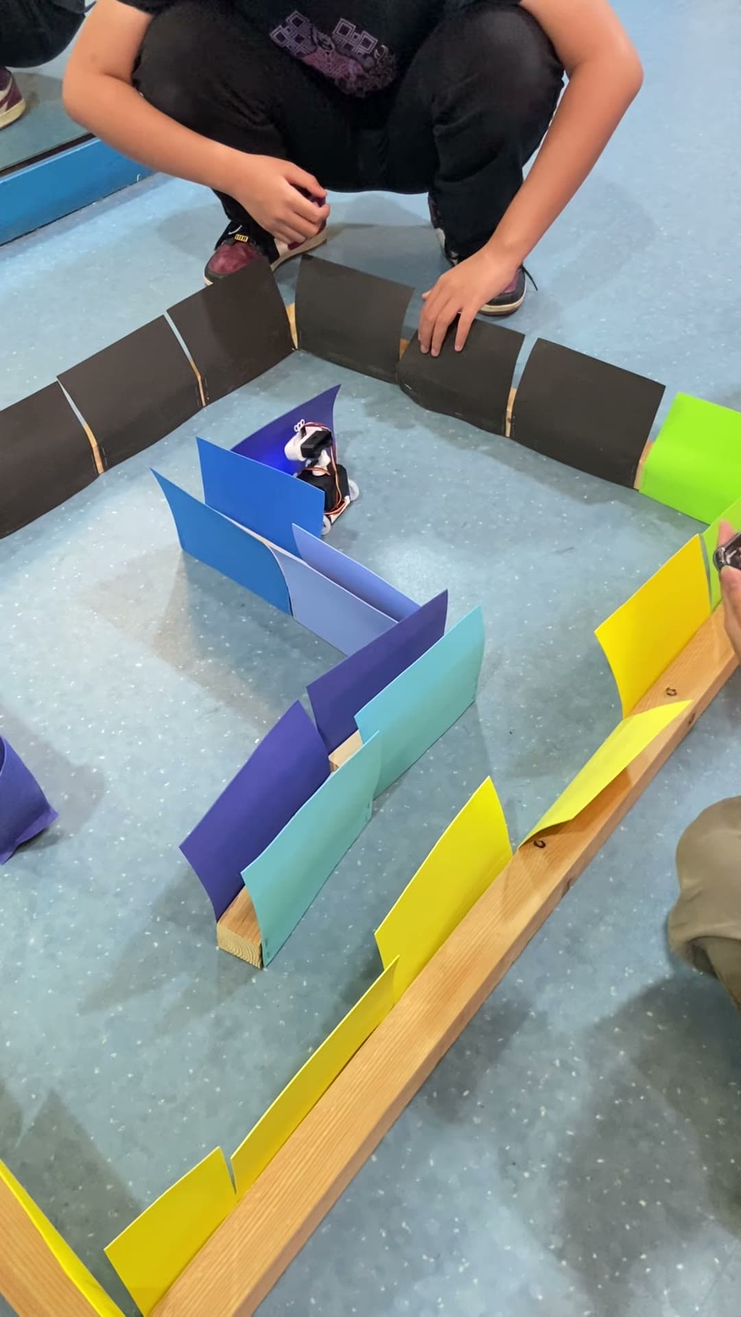 Maze-navigation course with a robot entering a turn
