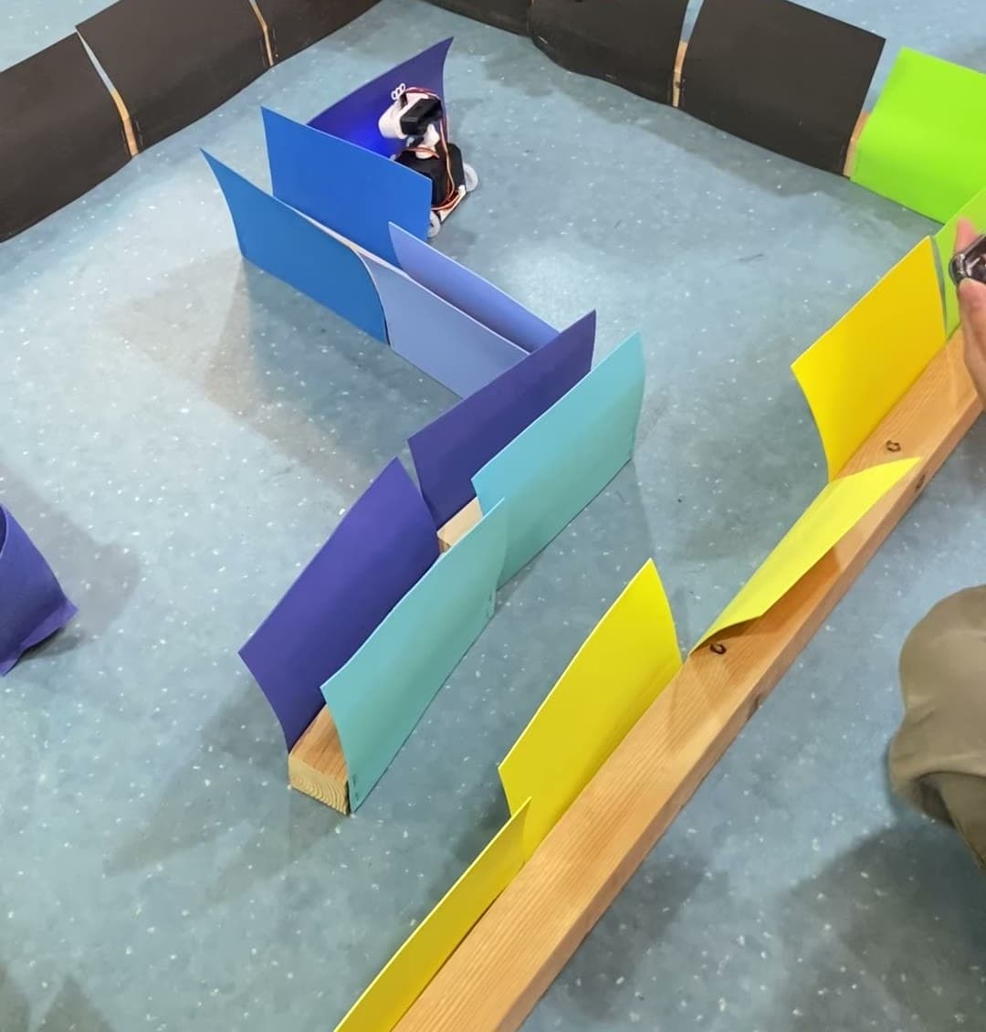 Maze-navigation course with a robot entering a turn