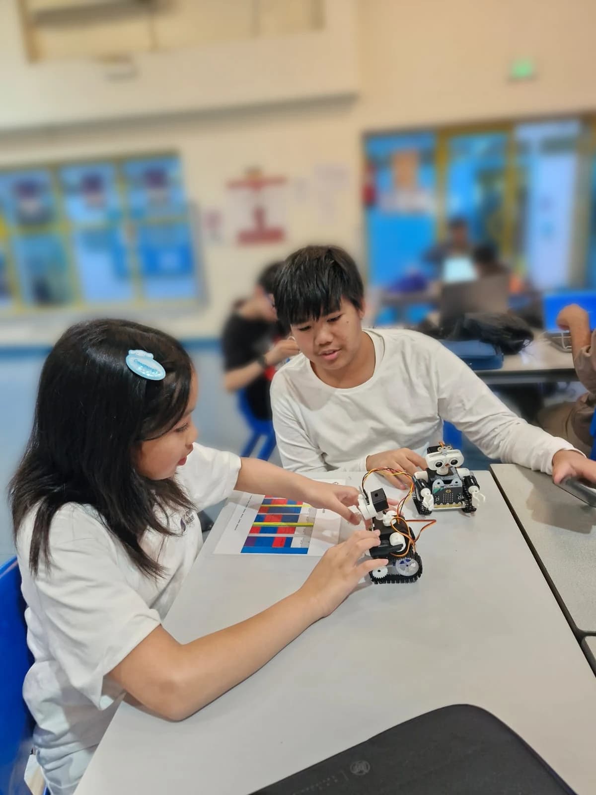 Students assembling robots together