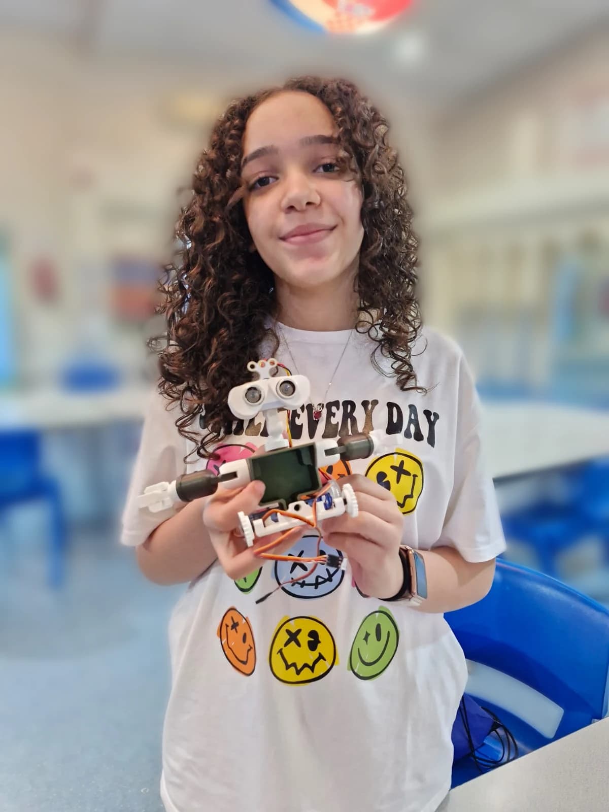 Student presenting a programmed robot
