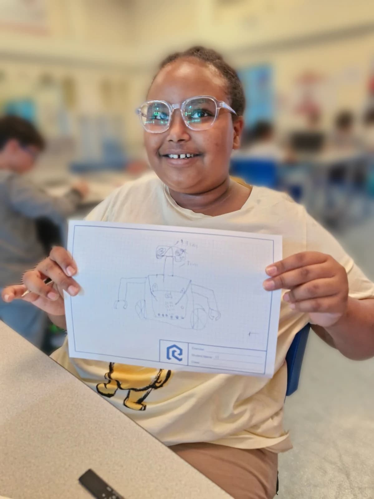 Student presenting an original robot sketch