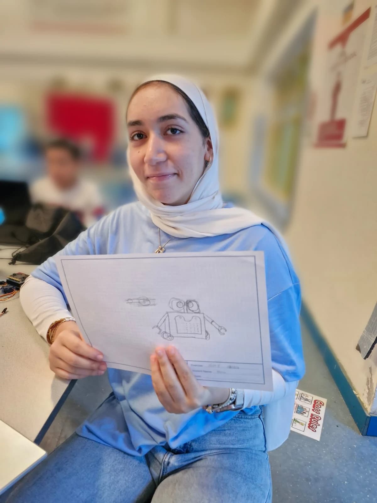 Student showing a robot design worksheet